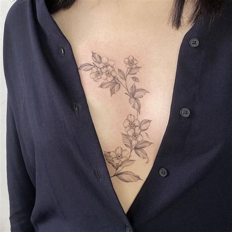 sternum between breast tattoos|The Ultimate Guide to Sternum Tattoos: Design Ideas。